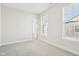 Bright bedroom with neutral walls, carpet, and natural light from two windows at 848 Kinzer Ave, Carmel, IN 46032