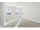 Bright bedroom with neutral walls, carpet, and natural light from three windows at 848 Kinzer Ave, Carmel, IN 46032
