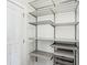 Walk-in closet with door, shelving and drawers for convenient and organized storage at 848 Kinzer Ave, Carmel, IN 46032