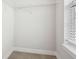 A simple closet with a wire shelf and window provides storage space at 848 Kinzer Ave, Carmel, IN 46032