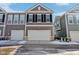 Townhouse exterior featuring a neutral color palette, attached garage, and classic architectural details at 848 Kinzer Ave, Carmel, IN 46032