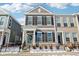 Charming two-story townhome with gray siding, black shutters, and a welcoming front entrance with black steel fencing at 848 Kinzer Ave, Carmel, IN 46032