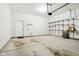 Spacious garage with overhead door, storage racks, and convenient access to the home at 848 Kinzer Ave, Carmel, IN 46032