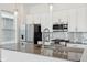 Well-lit kitchen features stainless steel appliances, a gas range, and a kitchen island with a sink at 848 Kinzer Ave, Carmel, IN 46032