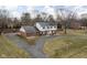 Aerial view of home showcasing circular driveway and large front and back yards at 8825 Dunsmuir Dr, Indianapolis, IN 46260