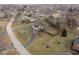 Sprawling property featuring a circular driveway and fenced-in backyard at 8825 Dunsmuir Dr, Indianapolis, IN 46260
