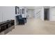 Spacious carpeted basement area featuring neutral walls, carpeted floors, and a chair at 8825 Dunsmuir Dr, Indianapolis, IN 46260