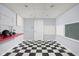 Finished basement with black and white checkered floors and a red countertop at 8825 Dunsmuir Dr, Indianapolis, IN 46260