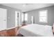 Bedroom with hardwood flooring, ample natural light, and closet access at 8825 Dunsmuir Dr, Indianapolis, IN 46260