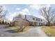 Charming two-story home with a brick and white facade and a well-manicured lawn at 8825 Dunsmuir Dr, Indianapolis, IN 46260