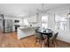 Modern kitchen with white cabinets, granite countertops, and stainless steel appliances at 8825 Dunsmuir Dr, Indianapolis, IN 46260