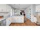 Bright kitchen features granite countertops, white cabinetry, and stainless steel appliances at 8825 Dunsmuir Dr, Indianapolis, IN 46260