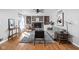 Cozy living room with a brick fireplace, hardwood floors, and natural light at 8825 Dunsmuir Dr, Indianapolis, IN 46260