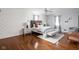 Spacious main bedroom featuring a decorative accent wall and lots of natural light at 8825 Dunsmuir Dr, Indianapolis, IN 46260