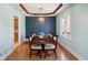 Elegant dining room featuring a dark wood table, seating for six, and a stylish chandelier at 901 Detroit St, Beech Grove, IN 46107