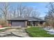 Charming single-story brick home featuring a two-car garage and well-maintained front lawn at 901 Detroit St, Beech Grove, IN 46107