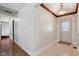 Bright foyer with tile flooring, wood trim ceiling detail and view of the home's entry door at 901 Detroit St, Beech Grove, IN 46107