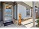 Inviting front entryway with a decorative glass door, a carved bear statue, and a welcome mat at 901 Detroit St, Beech Grove, IN 46107