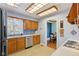 Charming kitchen featuring blue backsplash, bright lighting, and stainless appliances at 901 Detroit St, Beech Grove, IN 46107