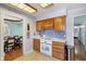 Cozy kitchen with bright countertop, wooden cabinets, and white appliances at 901 Detroit St, Beech Grove, IN 46107