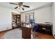 Home office featuring hardwood floors, built-in shelves, and modern ceiling fan at 901 Detroit St, Beech Grove, IN 46107
