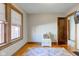 Bright bedroom features a colorful rug, natural light, and classic wood trim at 929 N Audubon Rd, Indianapolis, IN 46219