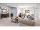 Finished basement with neutral walls, beige carpeting, and comfortable couches for relaxation at 9658 Farragut, Indianapolis, IN 46256