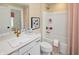 Bright bathroom featuring a vanity with a white quartz countertop and tub/shower combo at 9658 Farragut, Indianapolis, IN 46256