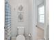 Bathroom featuring a blue and white striped shower curtain and neutral walls at 9658 Farragut, Indianapolis, IN 46256