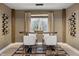 Elegant dining area with wine racks, seating, and a view to an egress window at 9658 Farragut, Indianapolis, IN 46256
