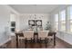 Bright dining room featuring a chandelier, modern decor, and natural light at 9658 Farragut, Indianapolis, IN 46256