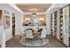Sophisticated dining room with a decorative ceiling, elegant lighting, and stylish decor at 9658 Farragut, Indianapolis, IN 46256