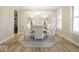 Cozy dining room with neutral colors and a round table set for an intimate gathering at 9658 Farragut, Indianapolis, IN 46256