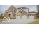 Beautiful two-story home boasting stone and brick, complete with a three-car garage at 9658 Farragut, Indianapolis, IN 46256
