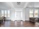 Bright foyer with wood floors, white trim, and large windows, creating an inviting entrance at 9658 Farragut, Indianapolis, IN 46256