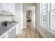 Hallway with natural light and view into an open concept living space at 9658 Farragut, Indianapolis, IN 46256