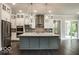 Modern kitchen with stainless steel appliances, a center island, and ample cabinet space at 9658 Farragut, Indianapolis, IN 46256