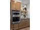 Detailed view of kitchen appliances and cabinets with designer touches at 9658 Farragut, Indianapolis, IN 46256