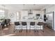 Bright kitchen with a large island, stainless steel appliances, and modern lighting fixtures at 9658 Farragut, Indianapolis, IN 46256