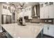 Modern kitchen featuring stainless steel appliances and a large kitchen island at 9658 Farragut, Indianapolis, IN 46256