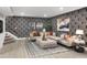 Stylish living room with a patterned accent wall and comfortable sectional sofa at 9658 Farragut, Indianapolis, IN 46256