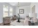 Cozy living room with natural light, stylish furnishings, and hardwood flooring at 9658 Farragut, Indianapolis, IN 46256