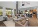 Spacious living room featuring open layout to the kitchen and plenty of natural light at 9658 Farragut, Indianapolis, IN 46256