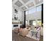 Bright living room with fireplace, large windows, and modern décor at 9658 Farragut, Indianapolis, IN 46256