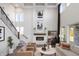 Bright living room featuring fireplace, soaring ceilings and ample seating at 9658 Farragut, Indianapolis, IN 46256
