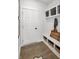 Well-organized mudroom with storage bench, baskets, and decorative details at 9658 Farragut, Indianapolis, IN 46256