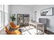 Bright office space with hardwood floors, modern shelving, and comfortable seating at 9658 Farragut, Indianapolis, IN 46256
