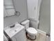 Neat bathroom featuring a vanity with sink, and glass shower doors at 1002 Payton Ave, Indianapolis, IN 46219