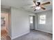 This bedroom features carpeted floors, a ceiling fan, and two large windows at 1002 Payton Ave, Indianapolis, IN 46219