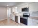 Updated kitchen with stainless steel appliances and granite countertops at 1002 Payton Ave, Indianapolis, IN 46219